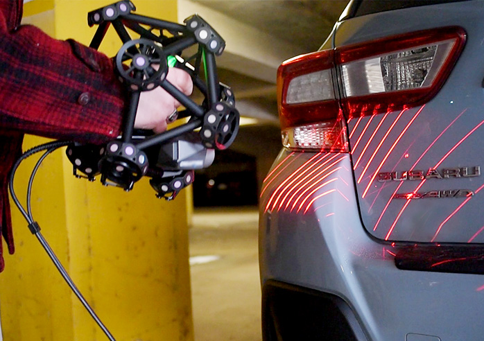 Image of a person scanning a car 